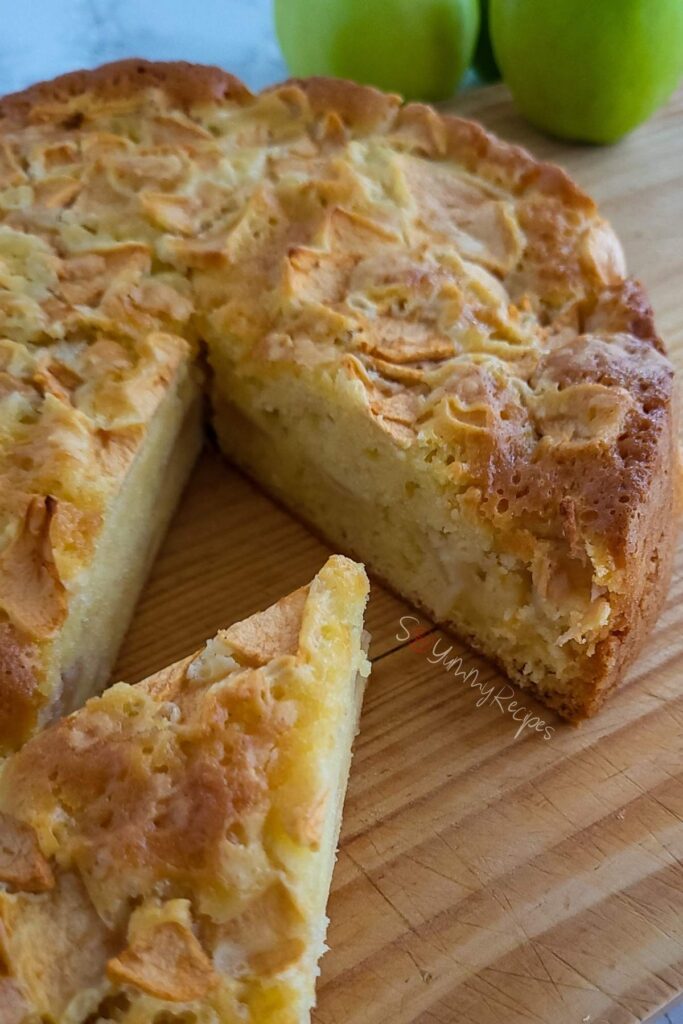 Apple cake made with Mary Berry's recipe on a chopping board.