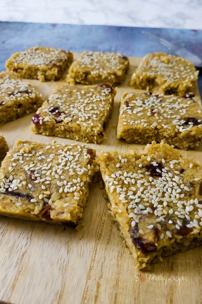 Oatmeal bars on a wooden chopping board.
