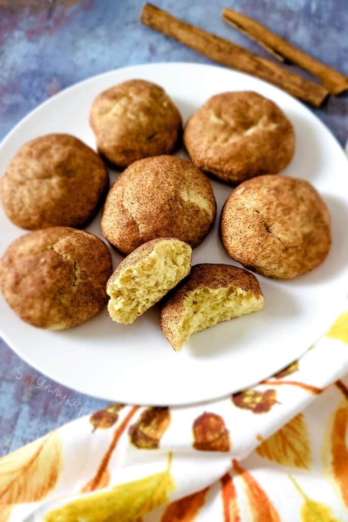 Some snickerdoodles on a white plate.