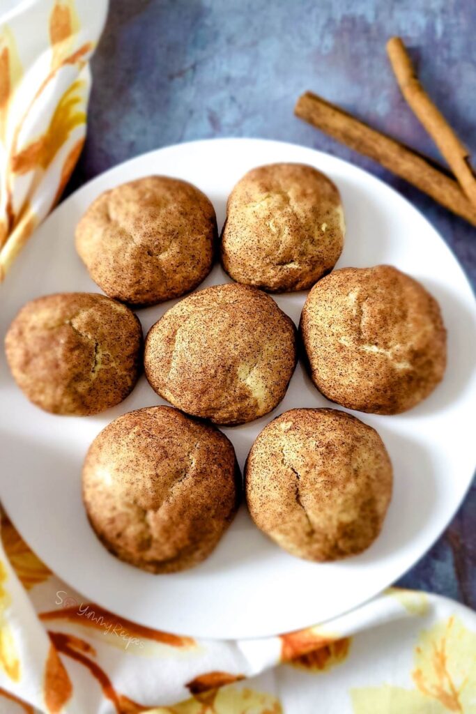 Snickerdoodles on a round white plate.