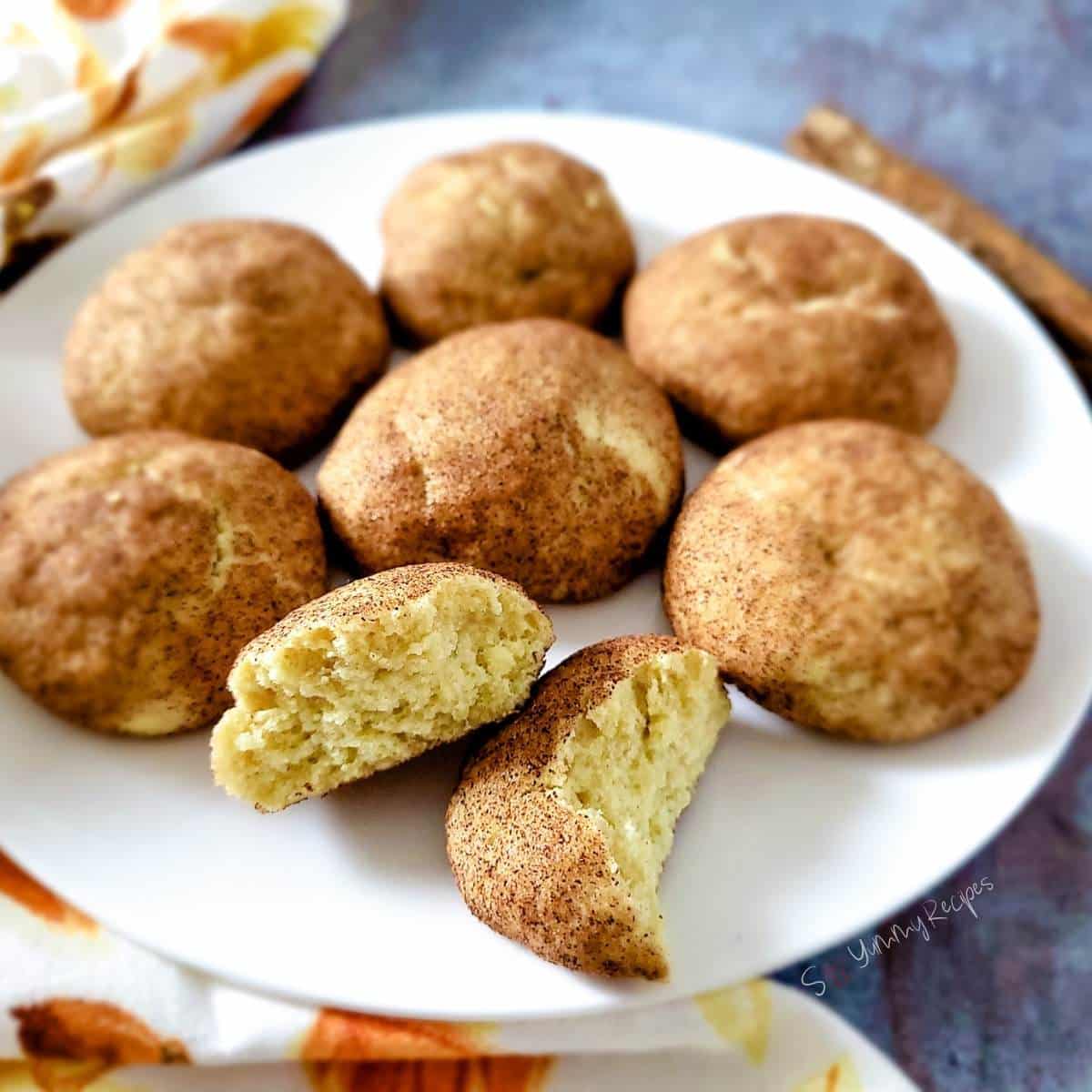 Snickerdoodles without cram of tartar on a white round plate.