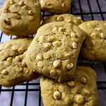 White chocolate chip cookies on a cooling rack.
