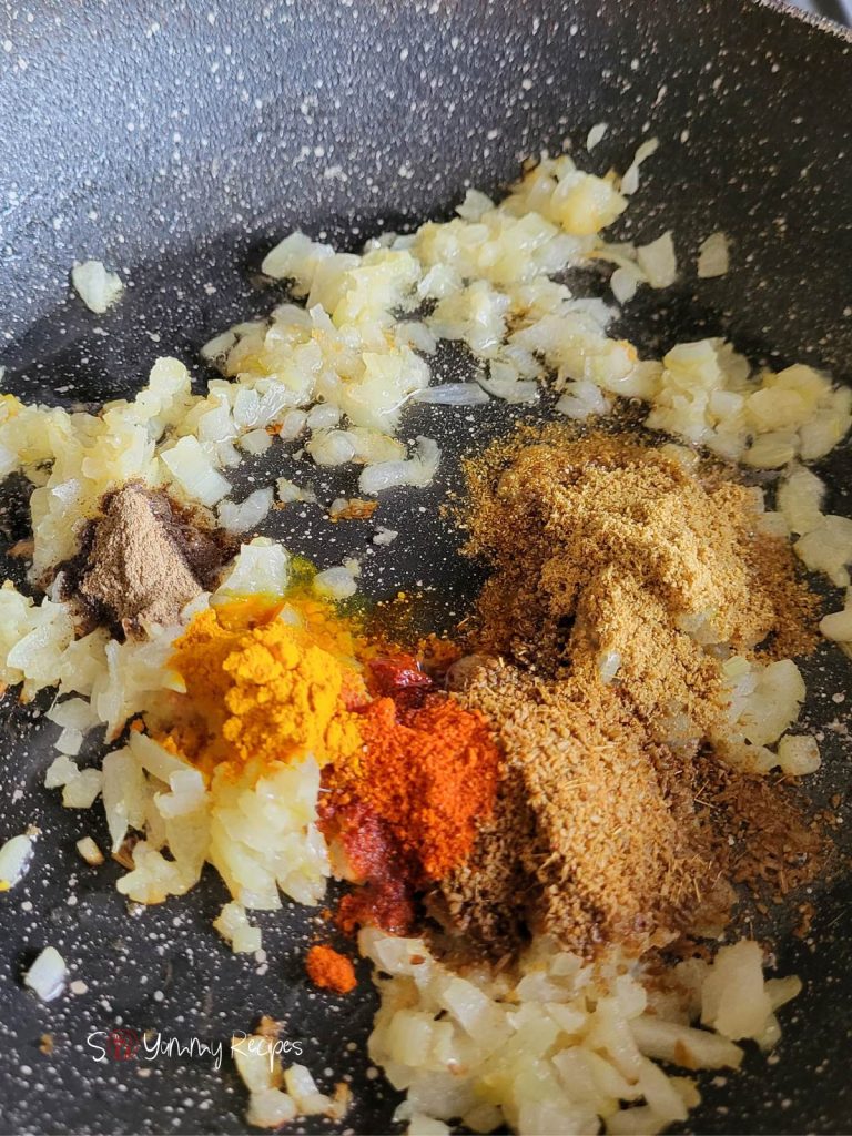 fried onions with some spices such as chili powder, turmeric powder, cumin powder and coriander powder.