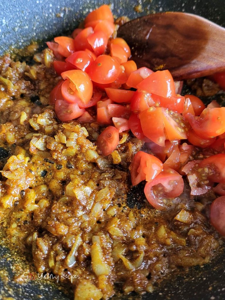 masala spice with chopped tomatoes.