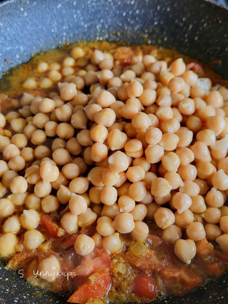 garbanzo beans on top of spice masala.