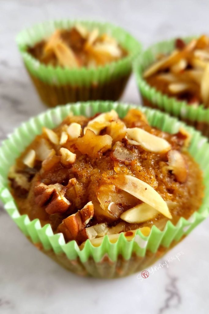 Almond flour pumpkin muffins in green muffin cases.