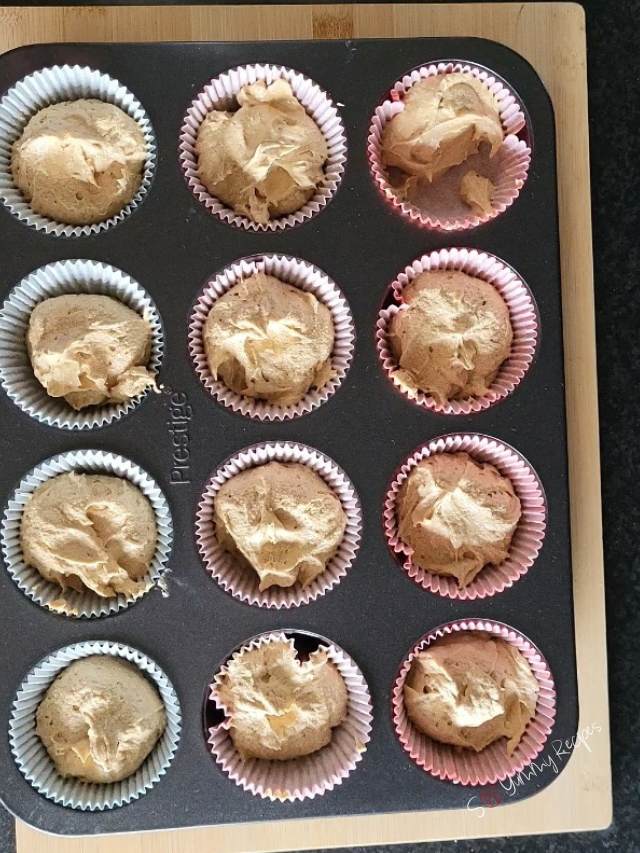 cupcake cases filled with batter.