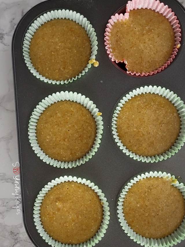 Muffin batter in muffin cases.