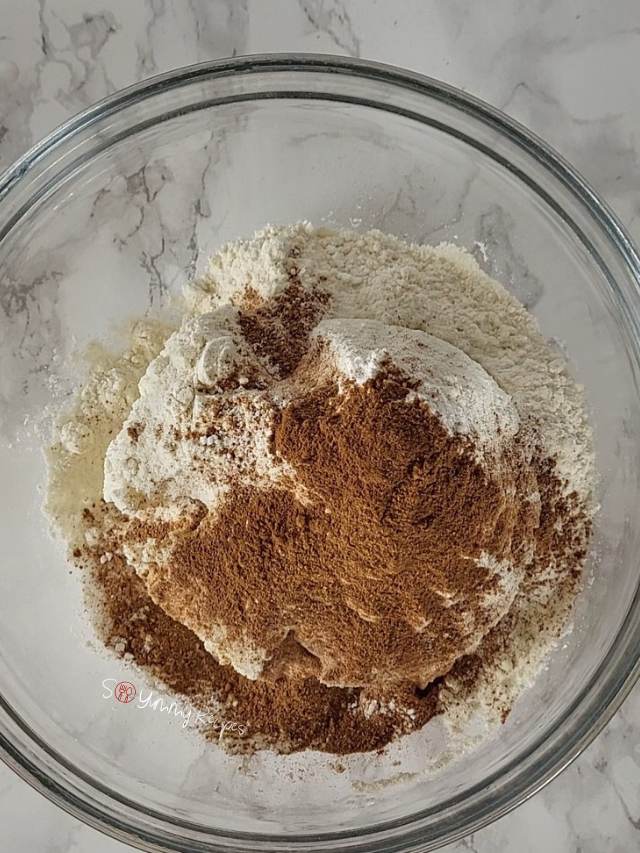 Almond flour, all-purpose flour, baking powder, salt, and pumpkin pie spice.