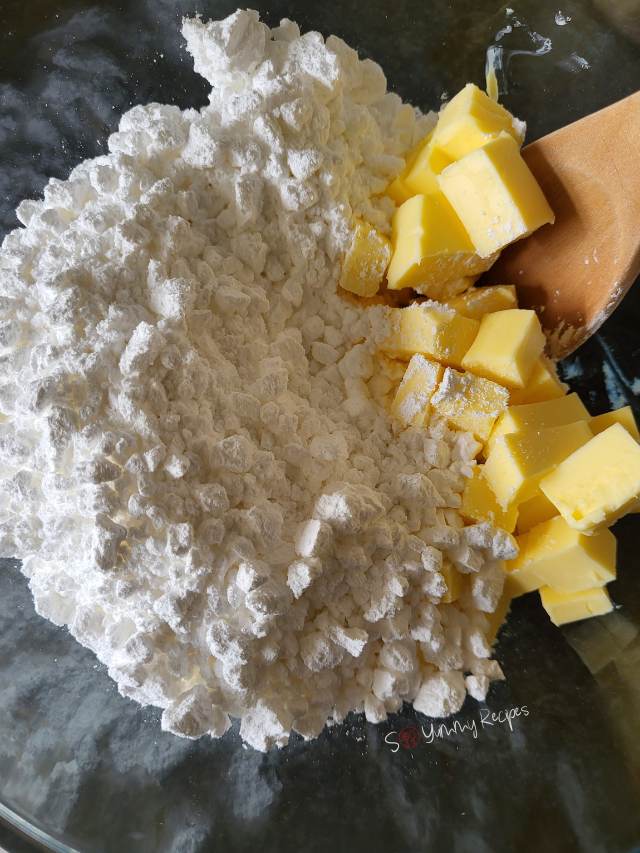 Butter and powdered sugar in a mixing bowl.