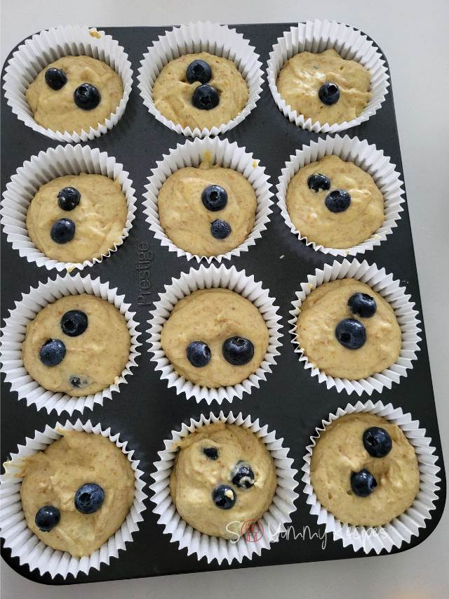 Muffin batter in muffin cases.