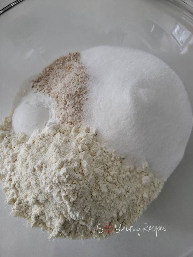 Whole wheat flour, all-purpose flour, caster sugar and baking powder in a mixing bowl.