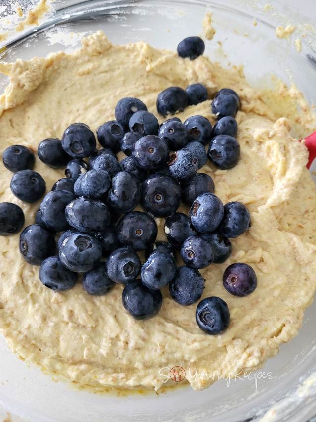 Blueberries in muffin batter.