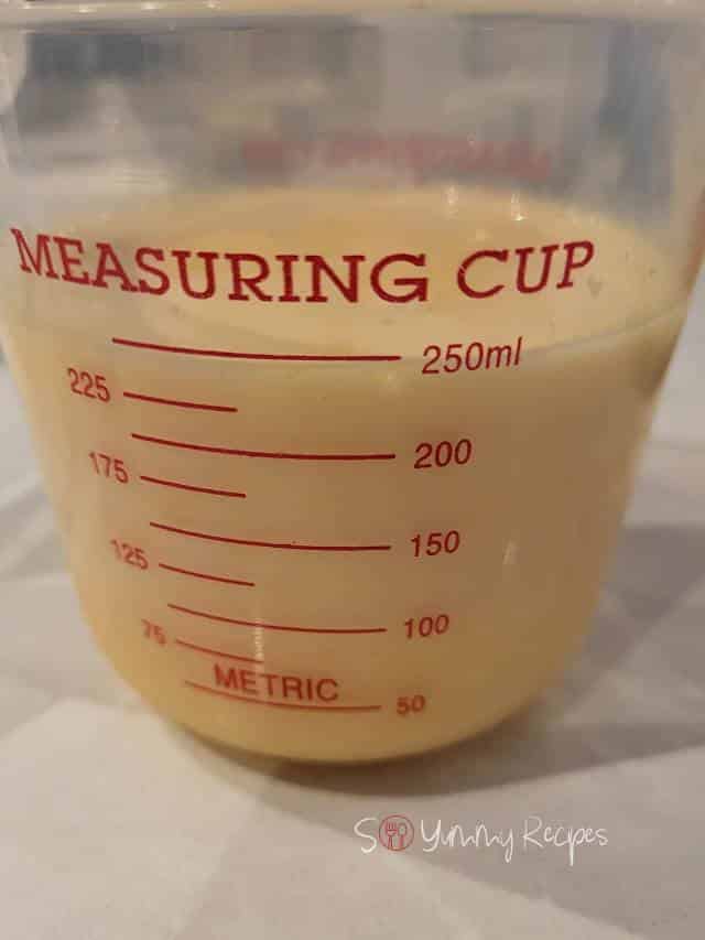 orange and milk mixture in a jug.