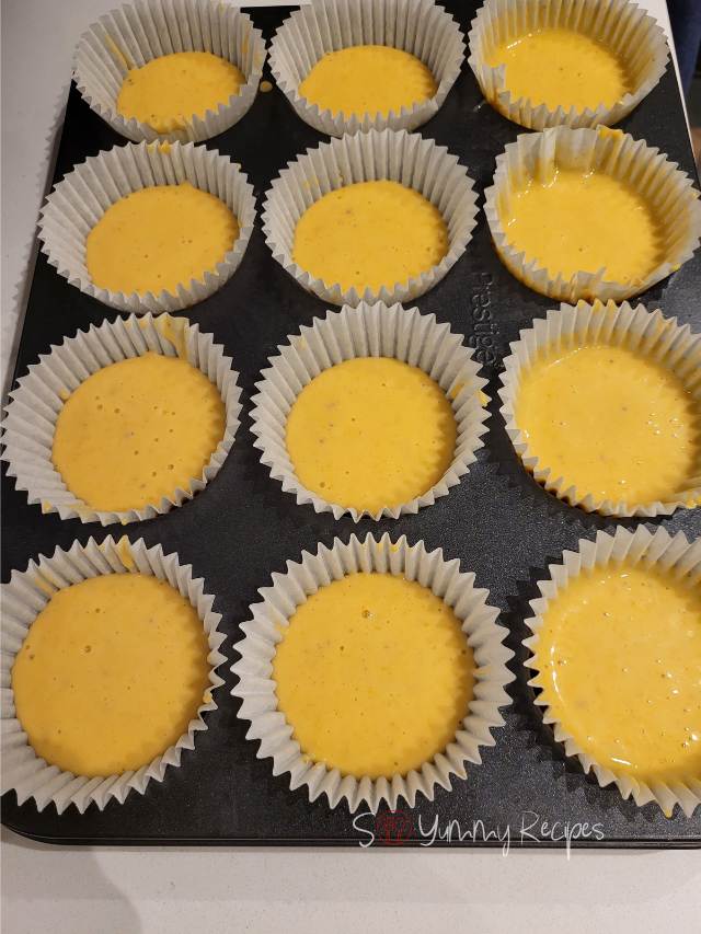 muffin batter in muffin cases.