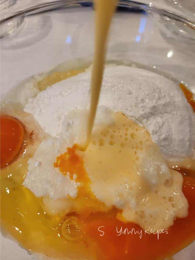 adding milk mixture to muffin ingredients.