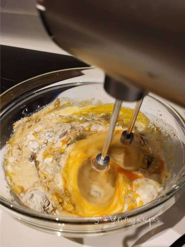 mixing the muffin ingredients.