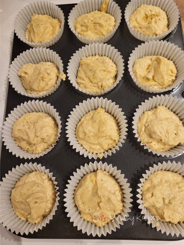 muffin batter in muffin cases.
