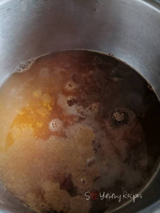 Boiling spices in a pan.