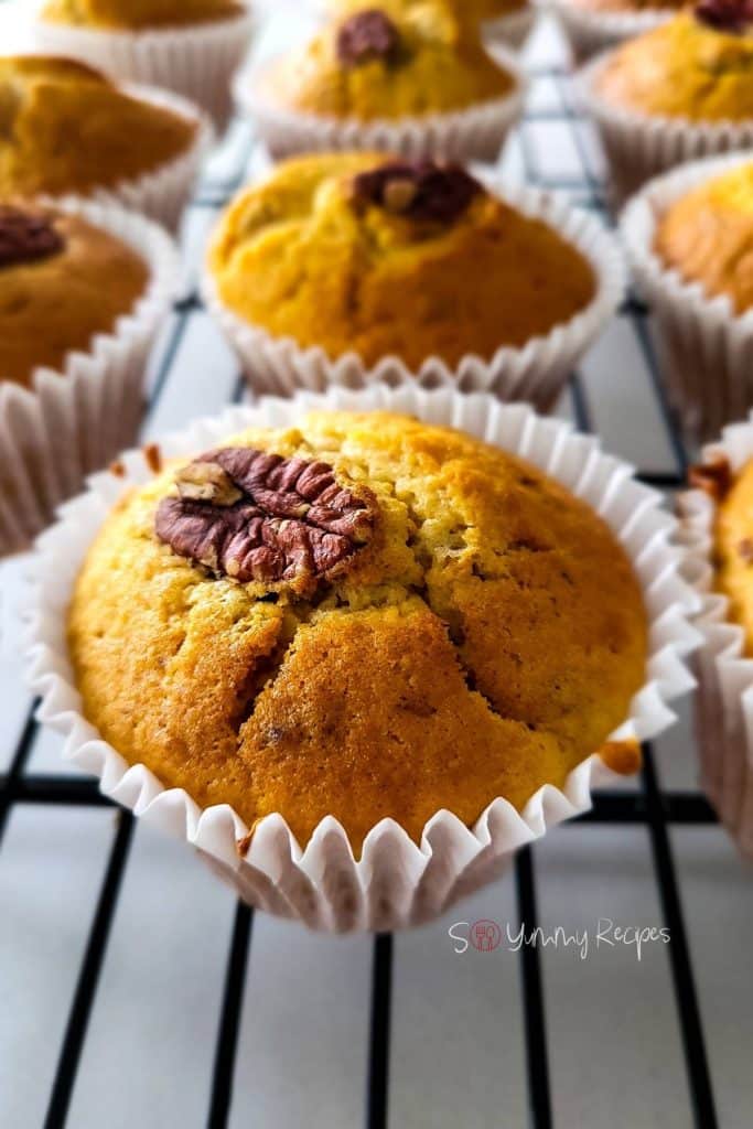 Maple pecan muffins on a wire rack.