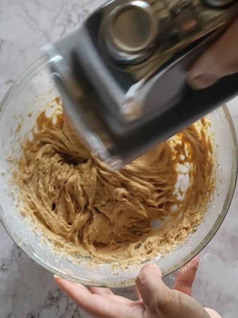 hand mixer beating the cake batter.