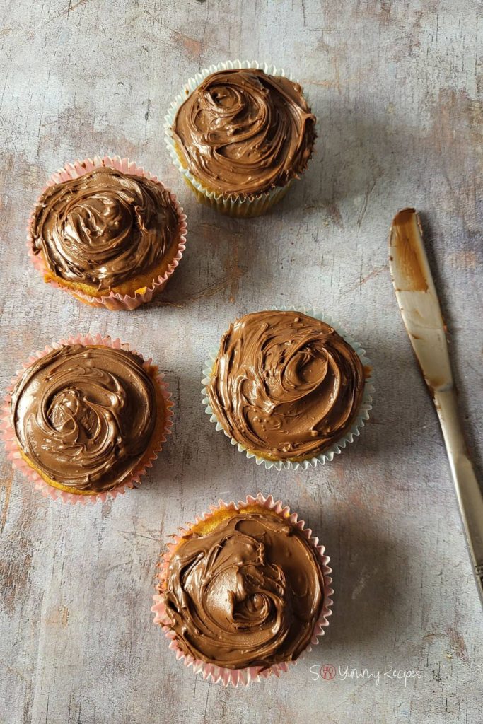 Cupcakes frosted with chocolate ganache.