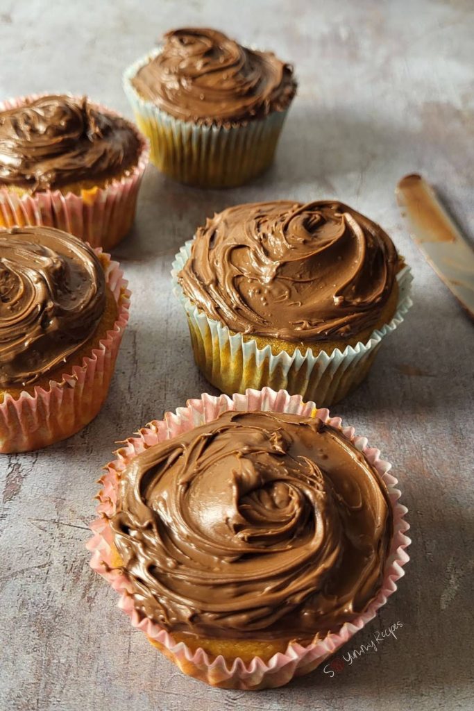 Banana cupcakes covered with chocolate ganache.