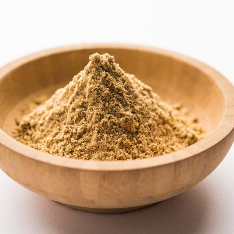 Chaat masala in a wooden bowl.