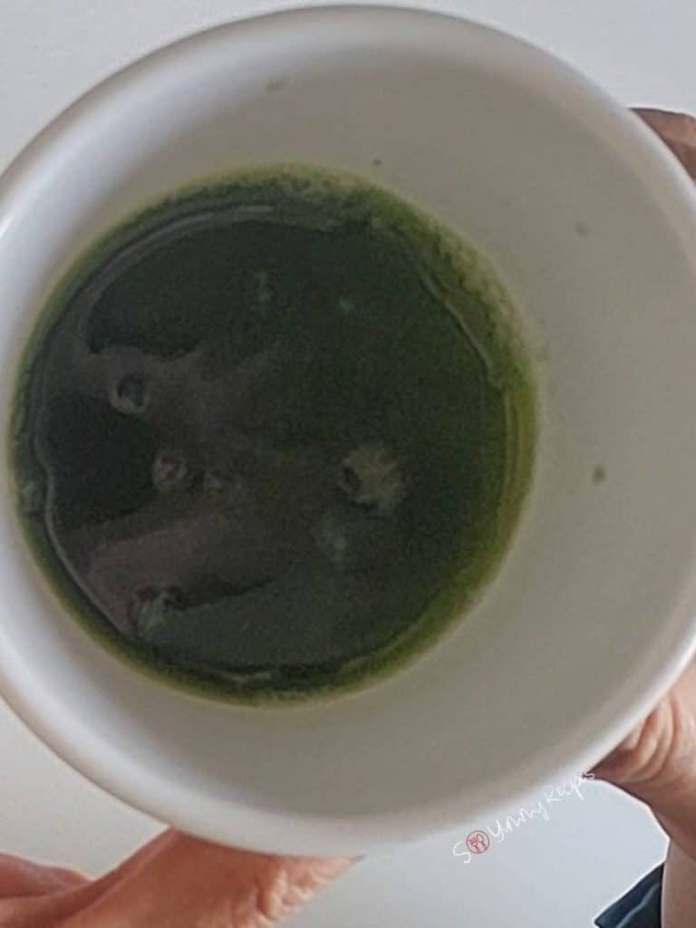 pandan juice in a small white bowl.