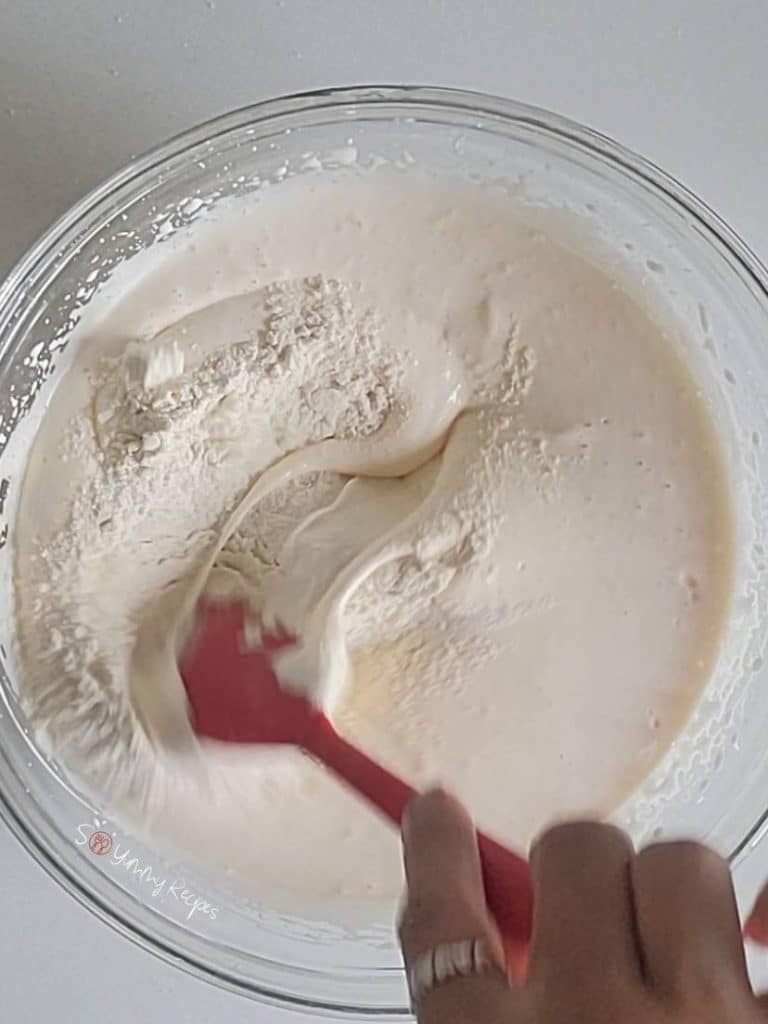 cake batter and a red spatula.