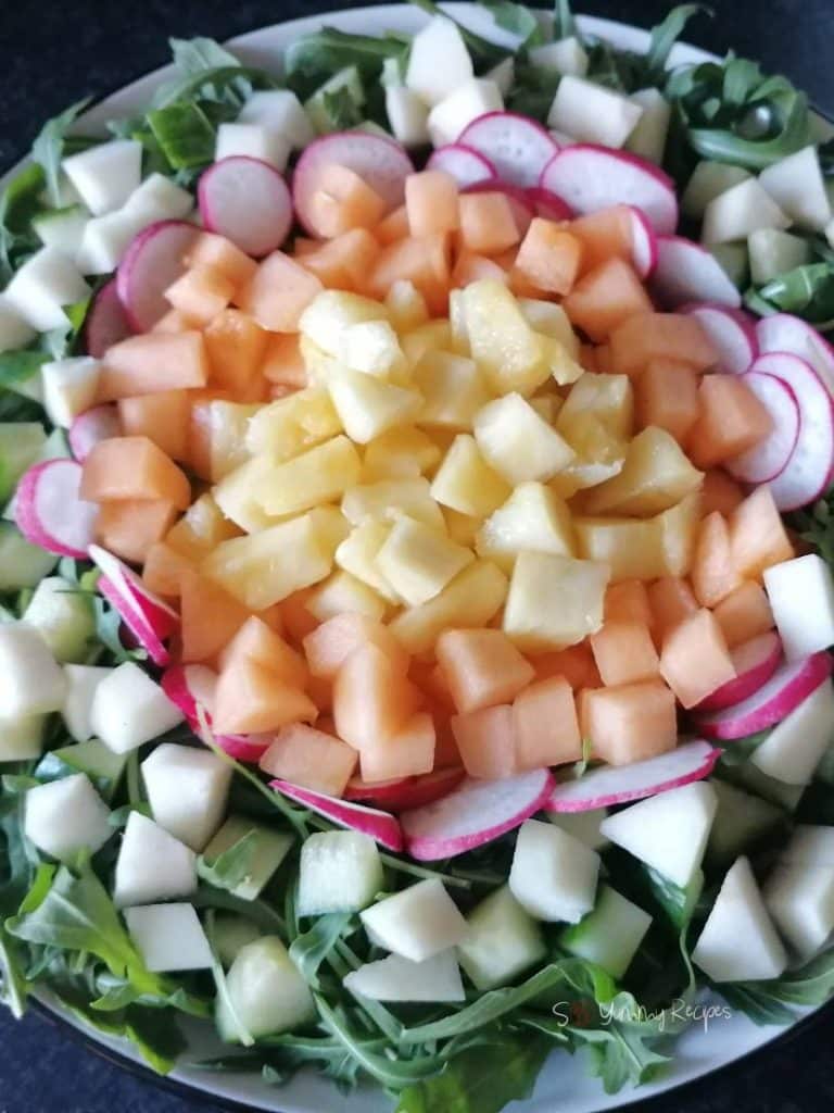 Melon, cucumber, radish, and pineapples.