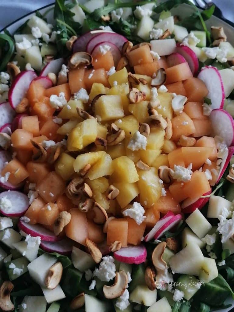 Melon, pineapple, radish, feta cheese, and cashew nuts.