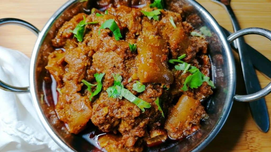 Lauki gosht in a metal serving bowl.