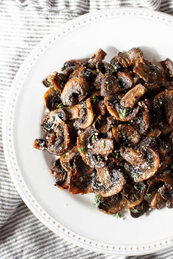 Mushrooms in a white dish.