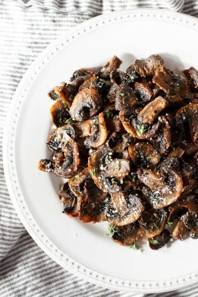 Mushrooms in a white dish.