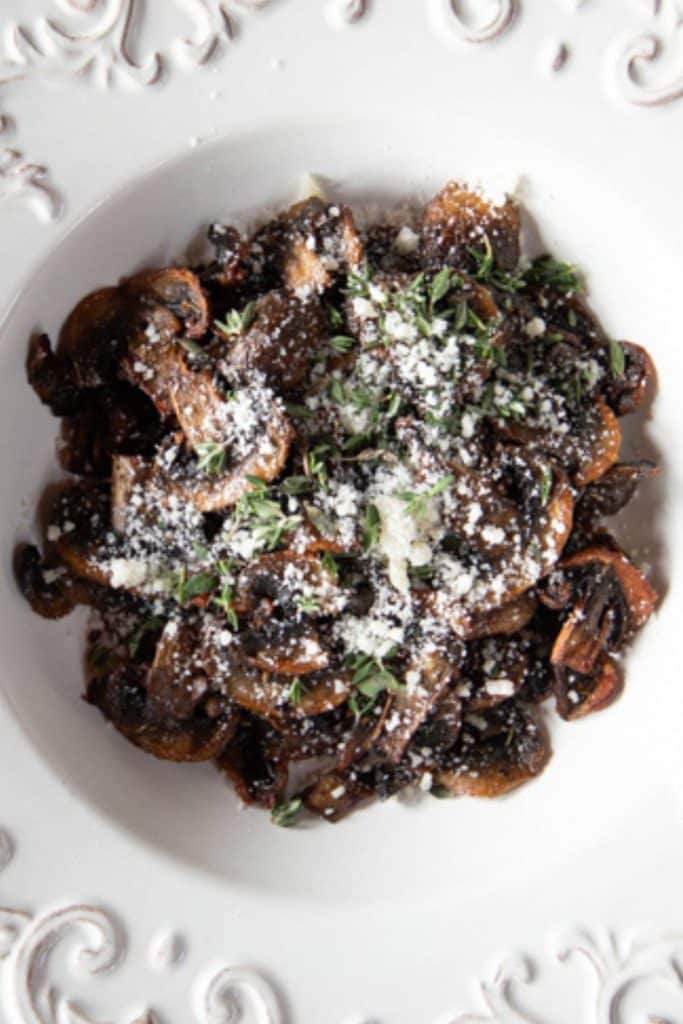 Air fryer mushrooms in a white dish.