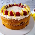 Lemon raspberry cake decorated with raspberries and lemon slices.