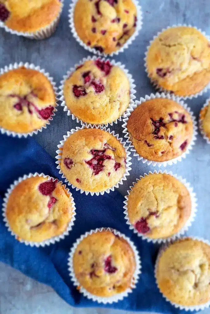 Muffins on blue napkin.