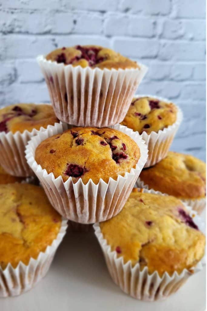 Stacked muffins on countertop.