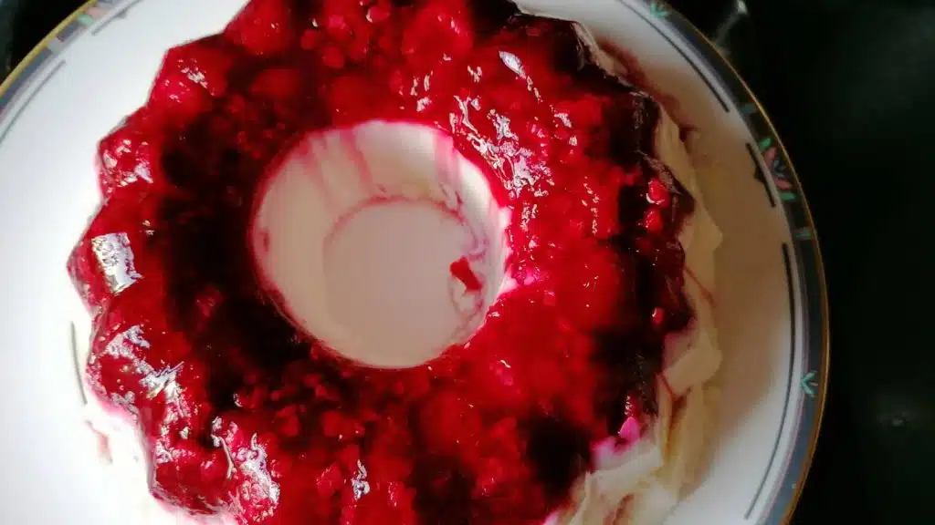 Agar agar milk pudding with raspberries.