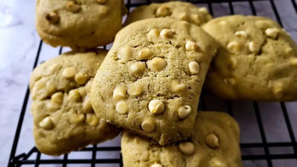 White chocolate chip cookies on a cooling rack.