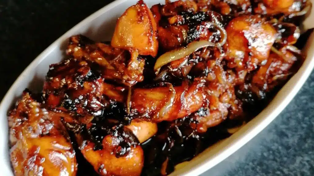 Sweet soy chicken in a white oval dish.