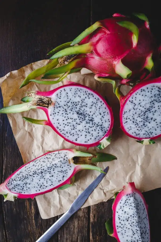 Cut dragon fruit on with a knife.