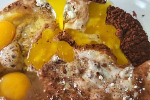 Eggs, melted butter over dry muffin ingredients.