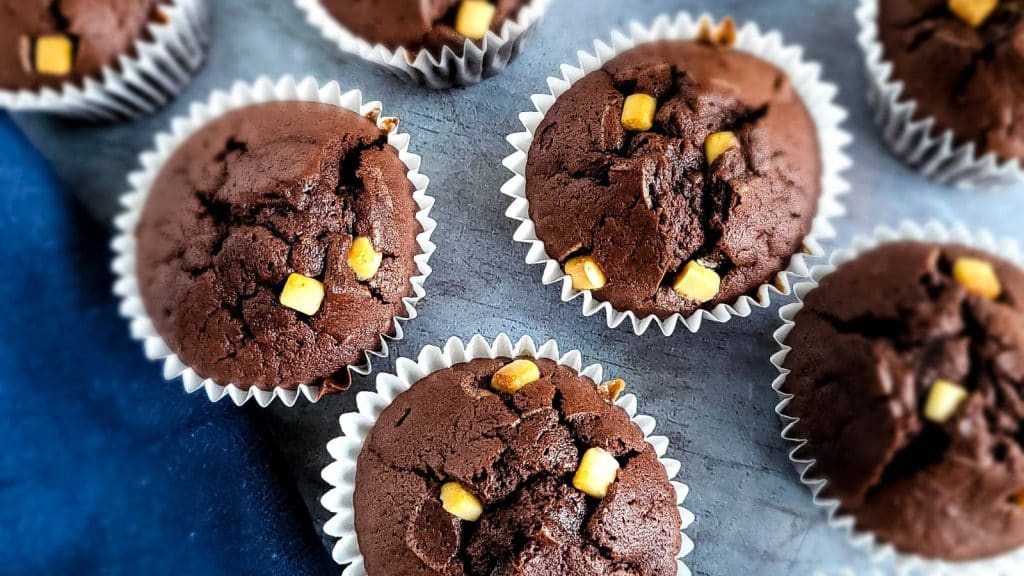 Chocolate muffins with white chocolate chips.