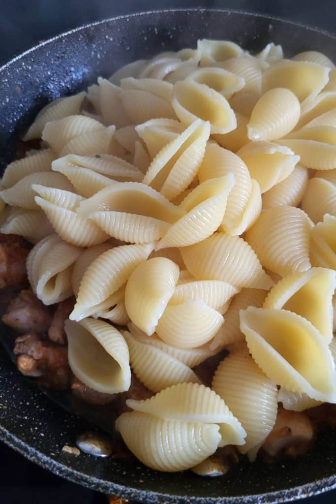 Cooked pasta shells.