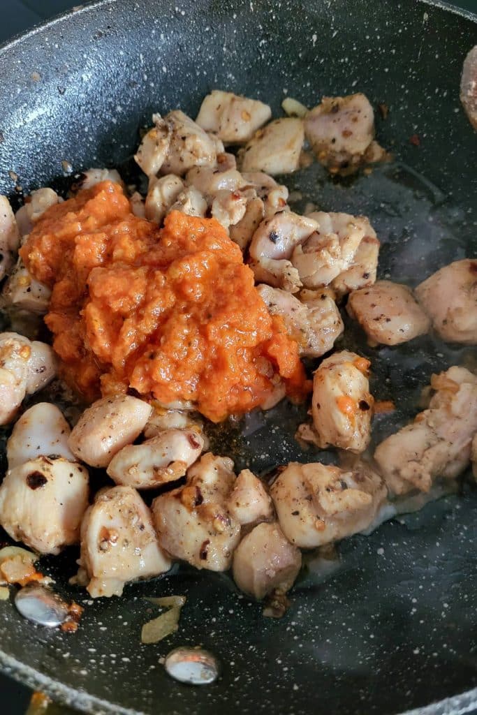 Cooked chicken with sun dried tomato sauce.