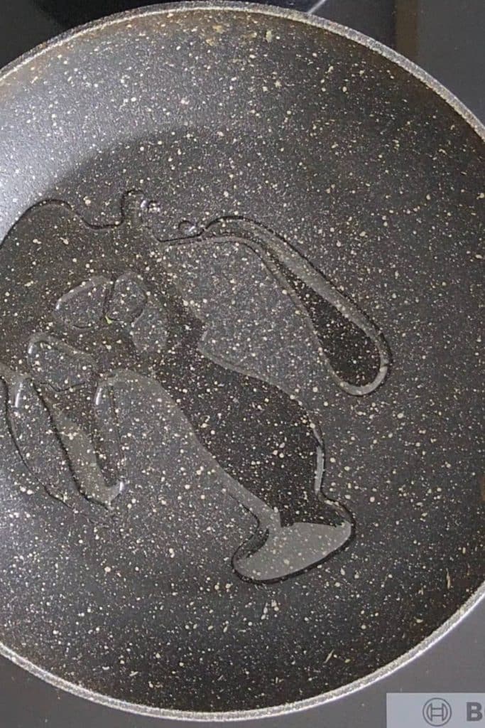 Cooking oil on a frying pan.