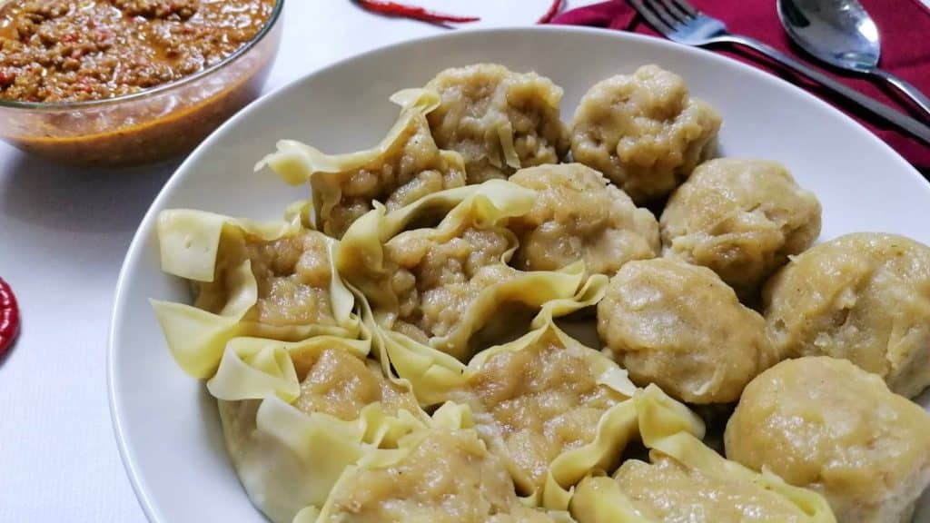 Indonesian version fish dumplings Siomay with a bowl of spicy peanut sauce.