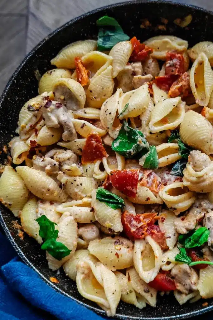 Chicken pasta with sun dried tomatoes and fresh basil.